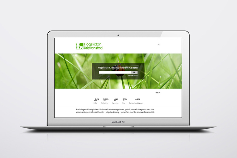 En dator med forskningsportalens startsida på skärmen.