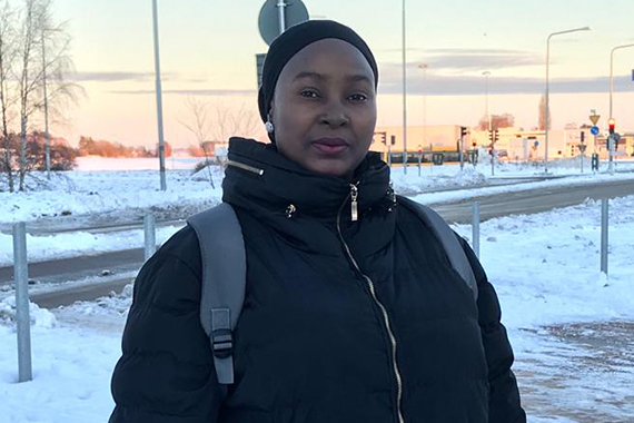 Aisha standing outside, snow on the ground