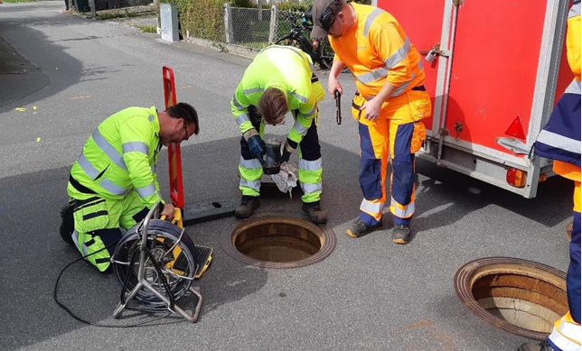 A picture that shows the maintenance work at drainage water system.