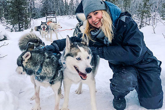 Alexandra with dogs in snow.